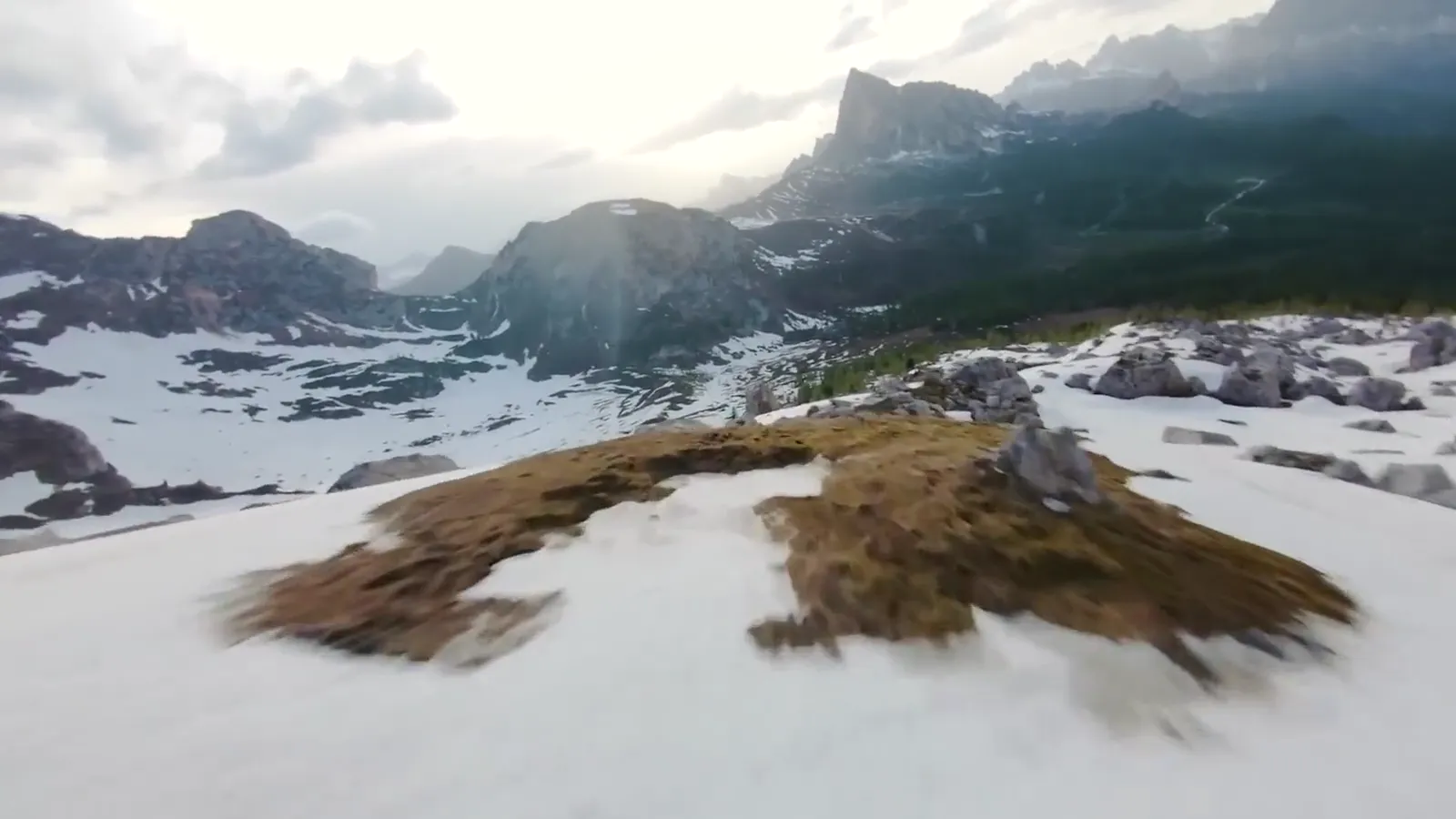 First-person view of a drone flying low over snow